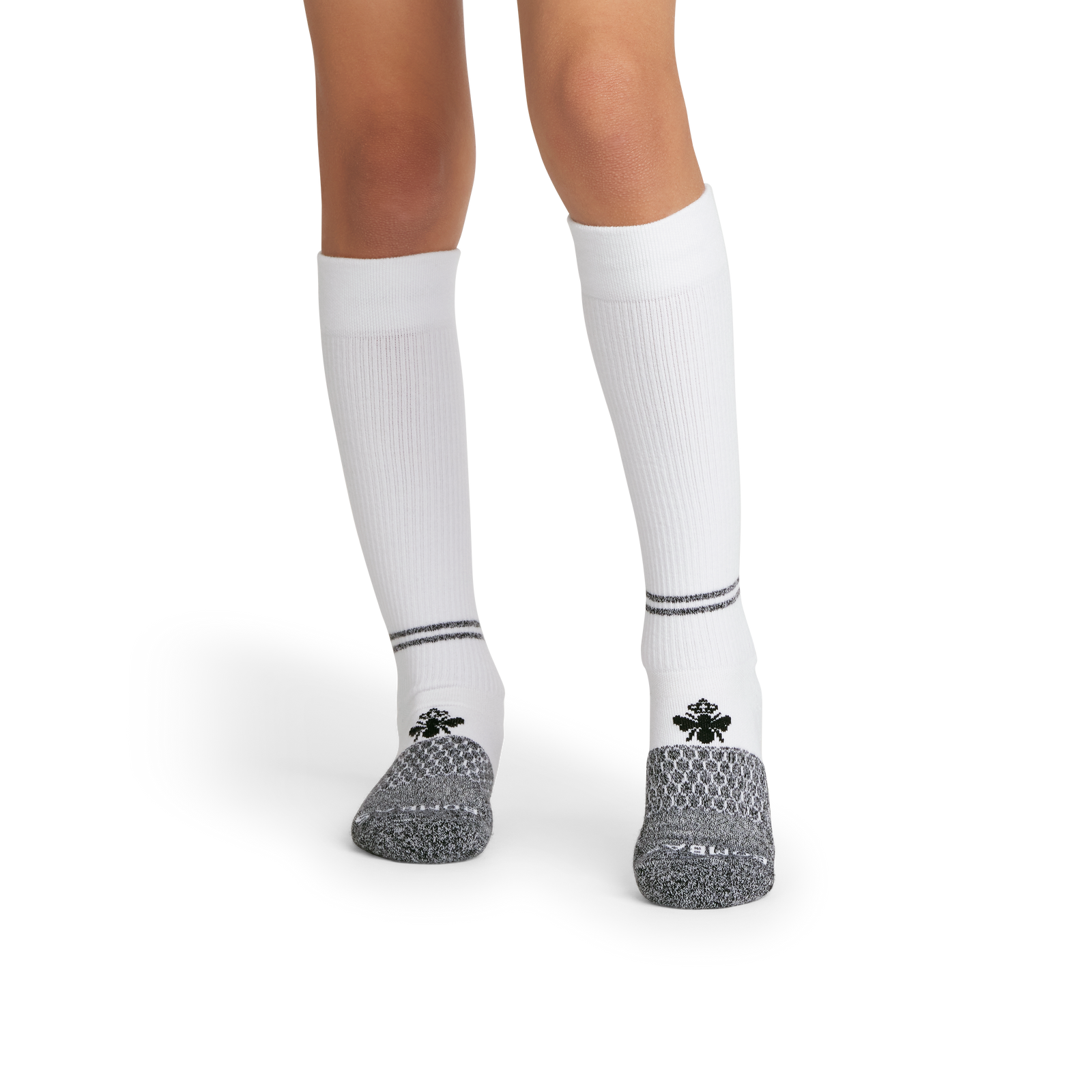 official-bombas::10479-white-black-youth-unisex-onmodel-2-transparent.png