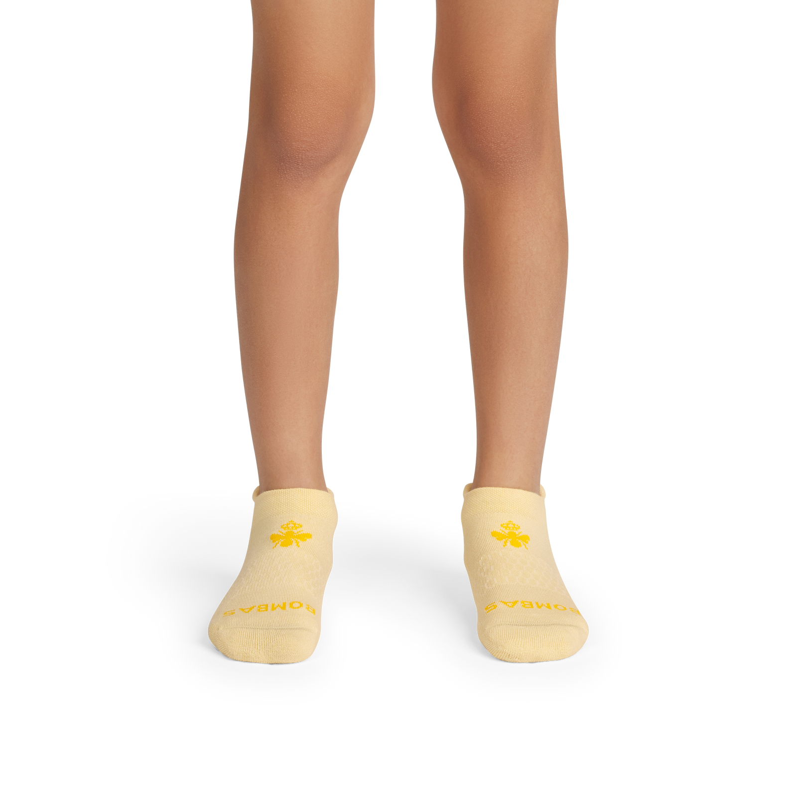 official-bombas::5747-meringue-softwhite-youth-unisex-onmodel-2-transparent.png