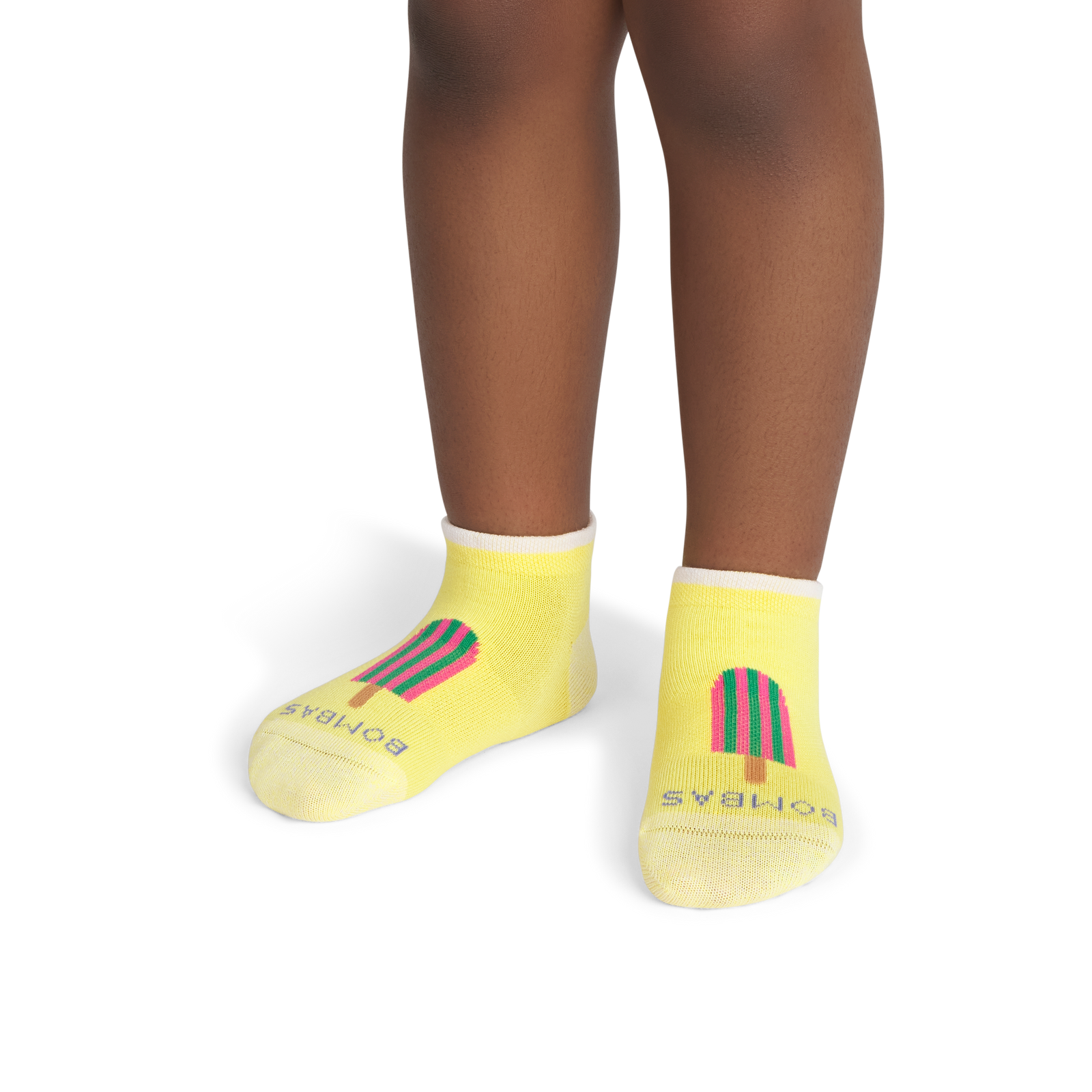 official-bombas::8842-glow-junior-unisex-onmodel-1-transparent.png