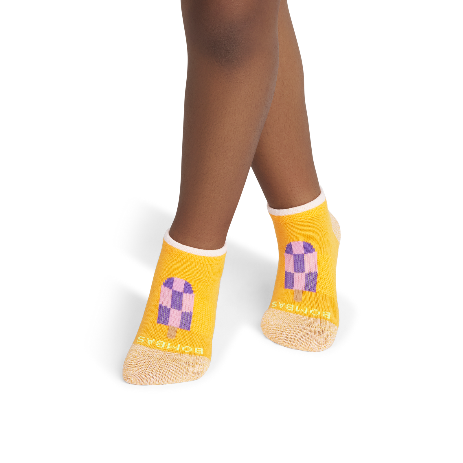 official-bombas::8843-tangerinepop-junior-unisex-onmodel-1-transparent.png